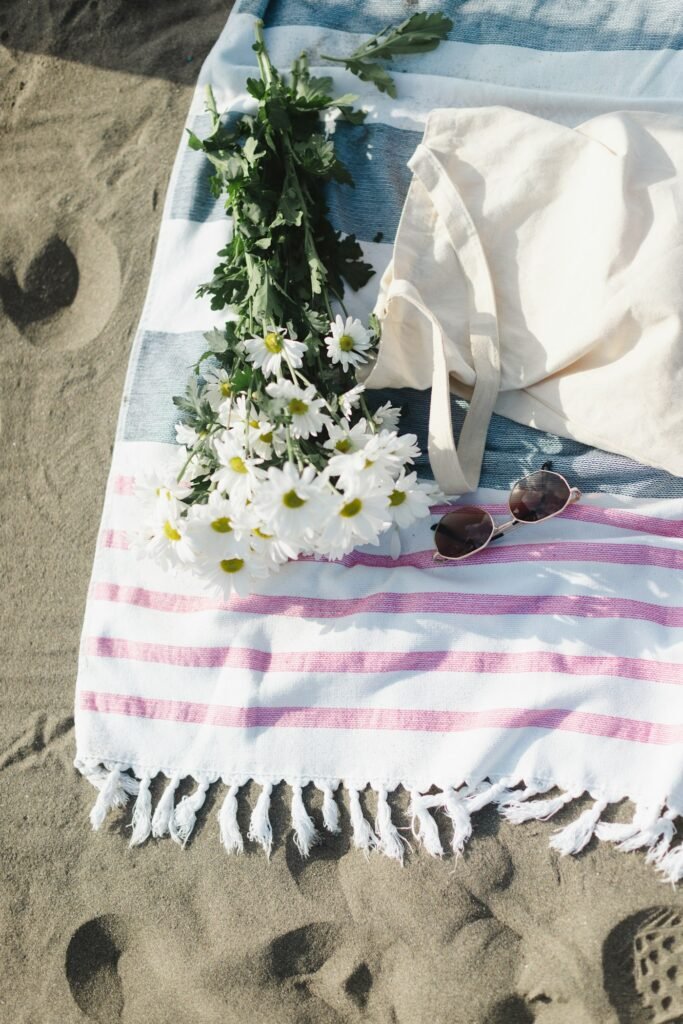 Linen beach blanket with flowers and a tote bag