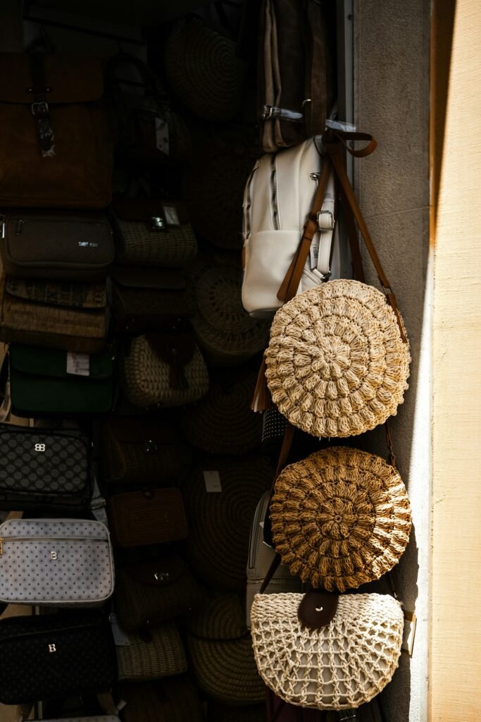Round rattan bags hanging in a shop