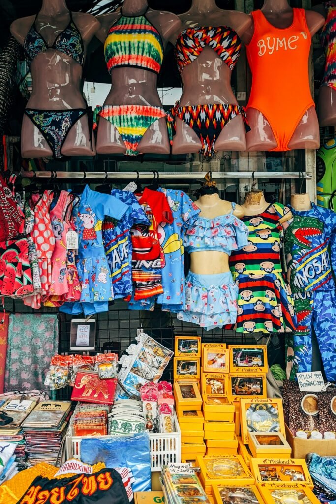 Rows of colorful swimwear at a beach shop